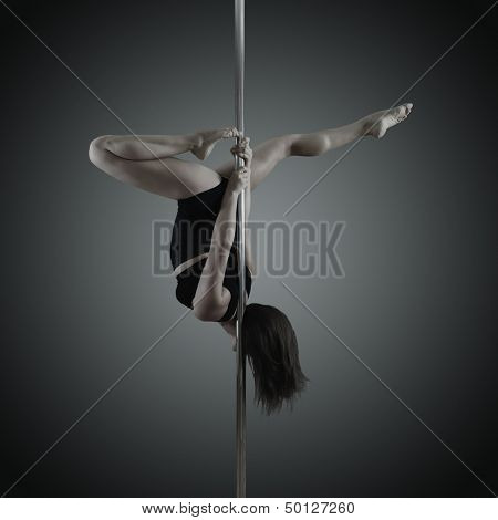 pole dancer, young woman dancing on pylon, toned and noise added
