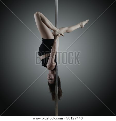 pole dancer, young woman dancing on pylon, toned and noise added