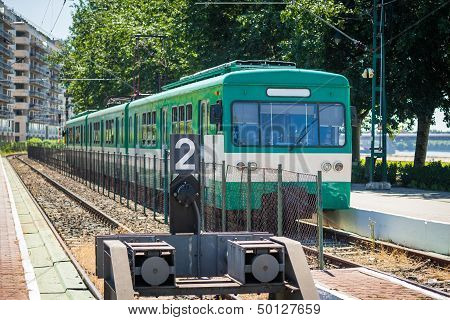 Green Suburb Train Waiting On A Staition In Budapest