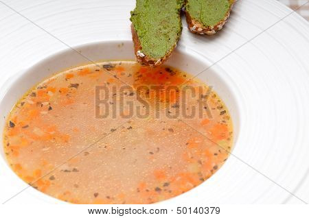 Italian Minestrone Soup With Pesto Crostini On Side