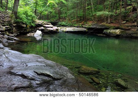 Mountain river with blue green water at Catskils mountains upstate NY