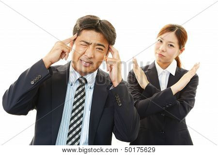 Dissatisfied businessman and businesswoman