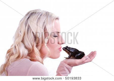 Woman kisses a frog