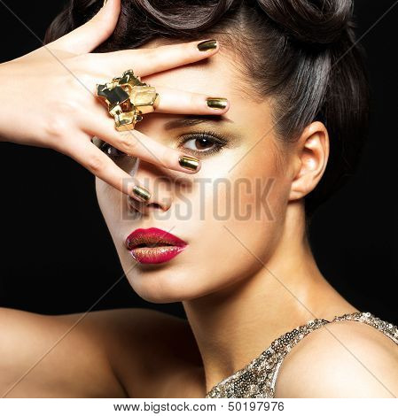 Beautiful Woman With Golden Nails And Style Makeup