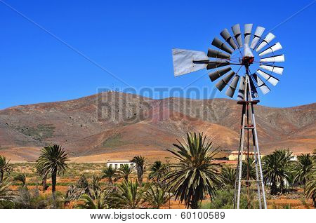 landscape of Antigua, in Fuerteventura, Canary Islands, Spain, with an old windpump in the foreground
