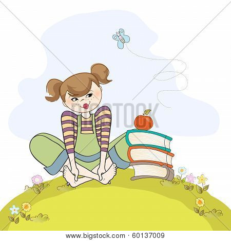 Studious Girl Sitting Barefoot In The Grass