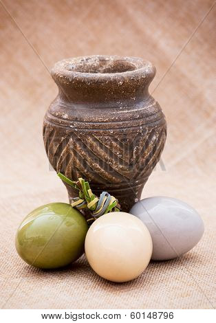 Three Shiny Easter Eggs With Ceramic Vase