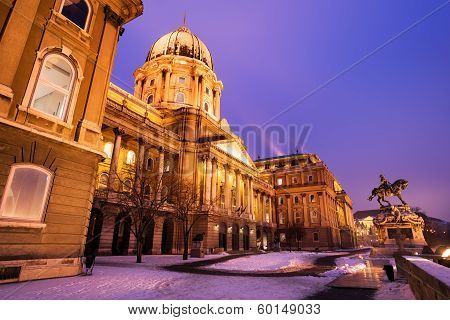 Snowy Buda Castle In Budapest Under A Purplish Blue Sky