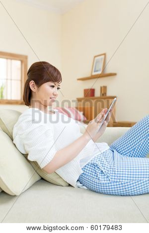 Beautiful asian woman relaxing in the room 