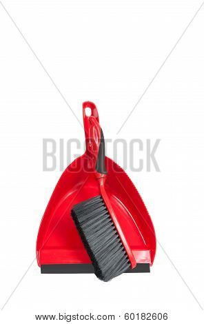 red dustpan with brush