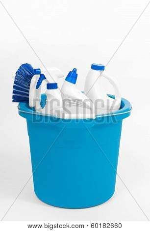 cleaning supplies in bucket on white background