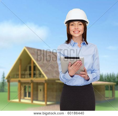 building, developing, consrtuction and architecture concept - friendly young smiling businesswoman in white helmet