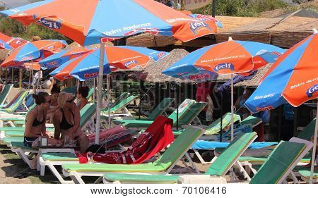 Tourists sunbathing on the beach
