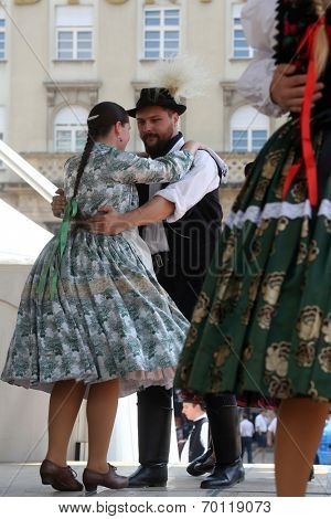 ZAGREB, CROATIA - JULY 19: Members of folk groups Nograd  from Salgotarjan, Hungary during the 48th International Folklore Festival in center of Zagreb, Croatia on July 19, 2014