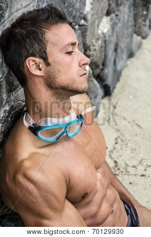 Handsome Young Man Relaxing At The Beach