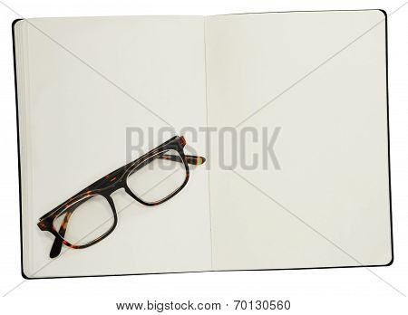 Glasses And Book On White