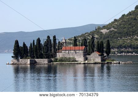 PERAST, MONTENEGRO - JUNE 08: Church of St George. Island of Saint George is one of the two islets off the coast of Perast in Bay of Kotor, Montenegro, on Jun 08, 2012