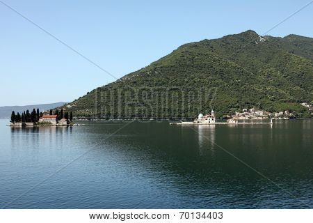 PERAST, MONTENEGRO - JUNE 08: The Church of St. George (left) and Dome of the Rock (right). Perast in Bay of Kotor, Montenegro, on June 08, 2012