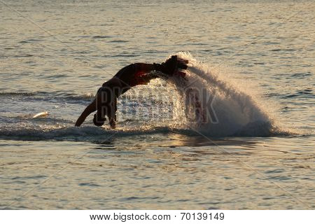 Flyboarder Diving In Up To His Arms