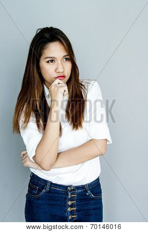 Potrait Asia Lady Mini Smile In Casual Suite White Shirt And Blue Jeans Thinking Concept