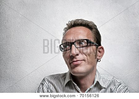 Close up portrait quit satisfied man with eyeglasses looking left and up with flirty flattery smile