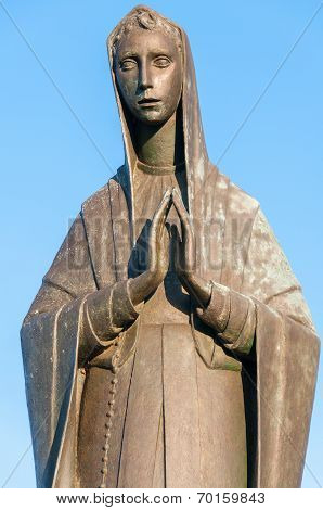 Madonna Statue With blue sky