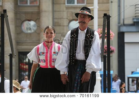 ZAGREB, CROATIA - JULY 19: Members of folk groups Nograd  from Salgotarjan, Hungary during the 48th International Folklore Festival in center of Zagreb, Croatia on July 19, 2014