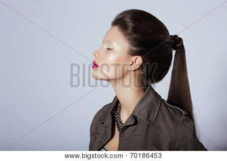 Beauty. Profile Of Young Stylish Brunette With Tress