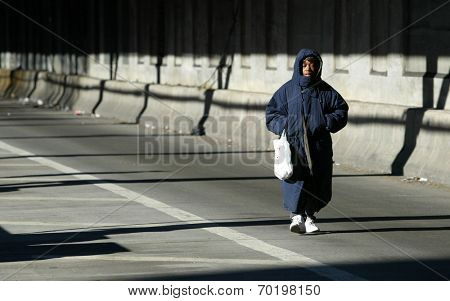 NEW YORK - DECEMBER 21:  A pedestrian walks over the Queensborough Bridge (59th Street Bridge) during the second day of the transit strike December 21, 2005 in New York City.