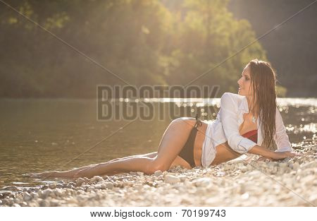 Preety Woman In Swimsuit Near Alpine River In Early Summer