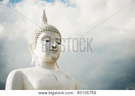 white buddha statue in the temple of Thailand