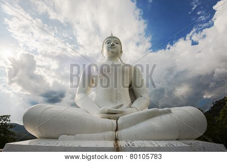 white buddha statue in the temple of Thailand