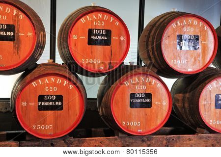 FUNCHAL, MADEIRA - OCTOBER 08, 2011: The museum - storage of expensive vintage wine Madera. Huge barrels are marked by data of wine