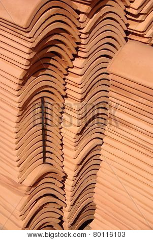 A stack of orange tiles