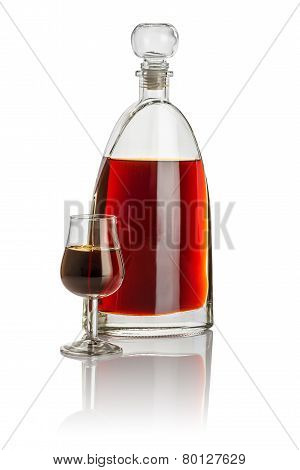 Carafe and snifter filled with brown liquid