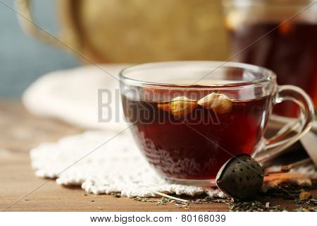 Beautiful vintage composition with herbal tea, on wooden table