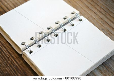 An empty retro spiral notebook with old paper