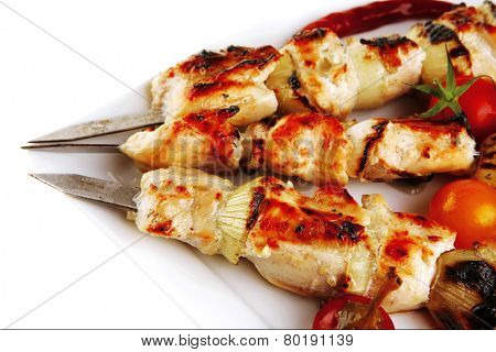 fresh roast chicken shish kebab on white platter