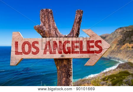 Los Angeles wooden sign with coast background