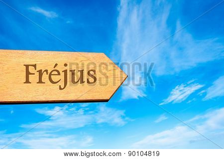 Wooden arrow sign pointing touristic destination