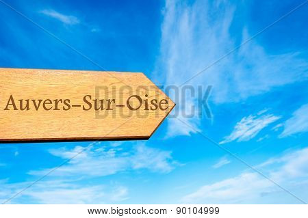 Wooden arrow sign pointing touristic destination
