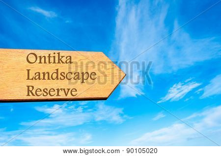 Wooden arrow sign pointing touristic destination