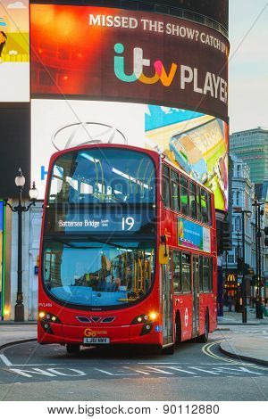 Piccadilly Circus Junction With The Red Double Decker Bus In London