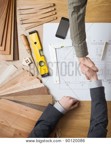 Businessman And Construction Engineer Working Together