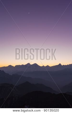 Twilight On Cattle Back Mountain With Moon In The Sky