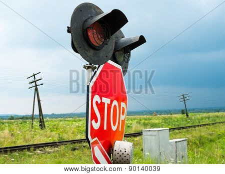 Traffic Lights And Signs At The Railroad Crossing