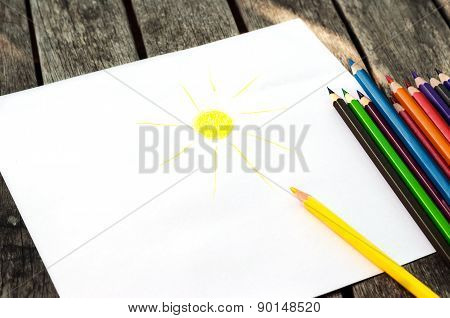 Colored Pencils With Painted Sun