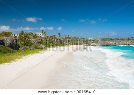 Harrismith Beach is one of the most beautiful beaches on the Caribbean island of Barbados. It is a tropical paradise with palms hanging over turquoise sea and a ruin of an old mansion on the cliff