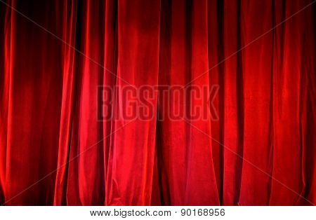 Part of a lighted red curtain