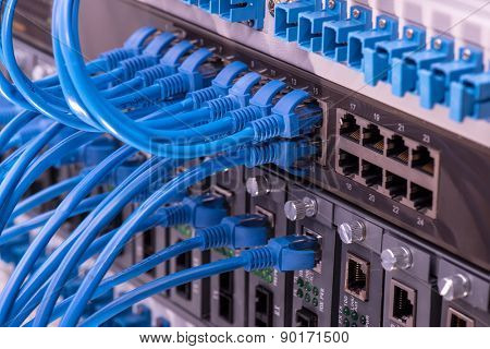 close up of network cables connected to switch